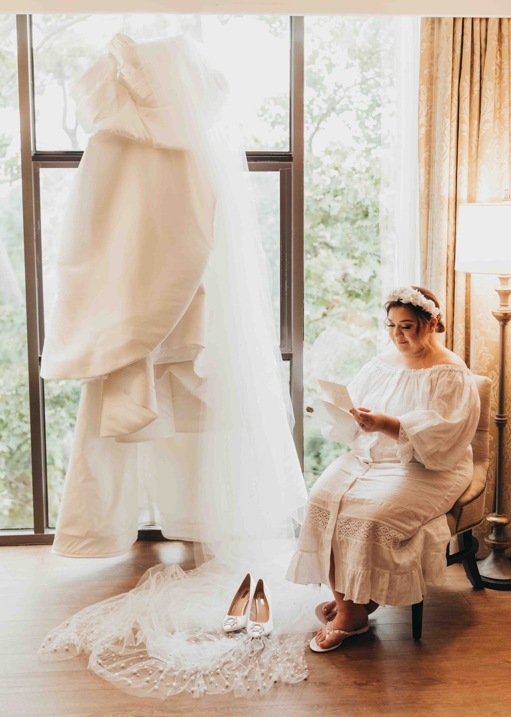 Bride reads letter from husband in private room at The Houstonian Spa.